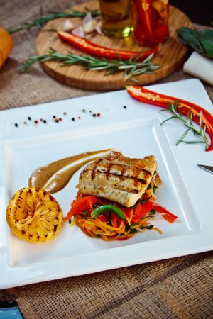 Photo for Baked perch fillet with rosemary and lemon with blanched vegetables - Royalty Free Image