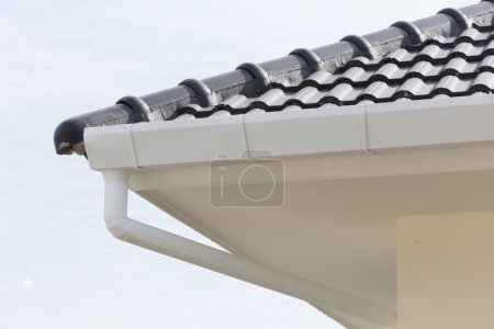 Photo for White gutter on the roof top of house - Royalty Free Image