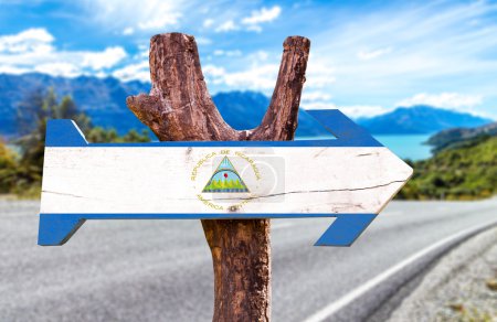 Photo for Nicaragua Flag on wooden sign with road background - Royalty Free Image