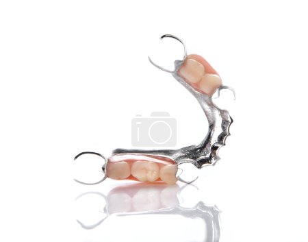 Photo for False teeth placed on white background. - Royalty Free Image