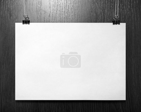 Photo for Blank horizontal paper poster on dark background. Front view. - Royalty Free Image