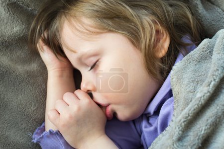 Photo for Sleeping little cute baby sucking thumb - Royalty Free Image