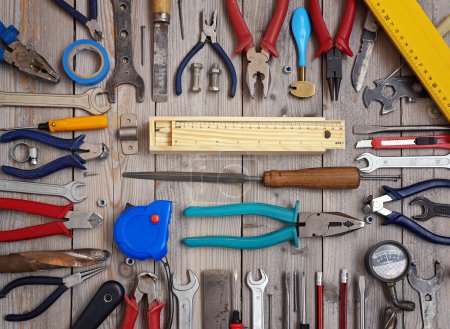 Tools on a wooden floor, top view.