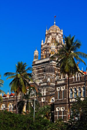 Photo for Church Gate in historical Mumbai centre with palm trees on blue sky background - Royalty Free Image