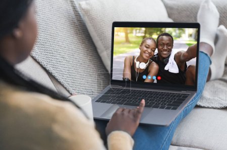 Photo for Digital communication concept. Young lady having video call with happy black couple on laptop from home. Millennial African American woman speaking to her friends on internet - Royalty Free Image