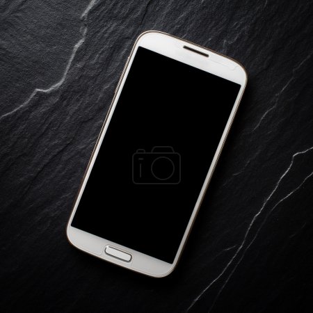 Photo for White mobile phone on dark background - Royalty Free Image