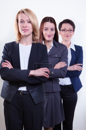 Smiling businesspeople standing together 