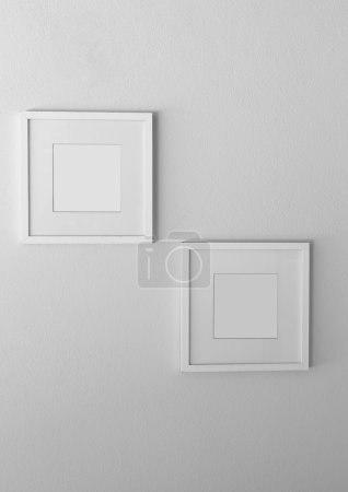 Téléchargez les photos : Cadre photo blanc vierge sur mur blanc - en image libre de droit