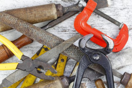 Photo for Set of old tools in a wood background - Royalty Free Image