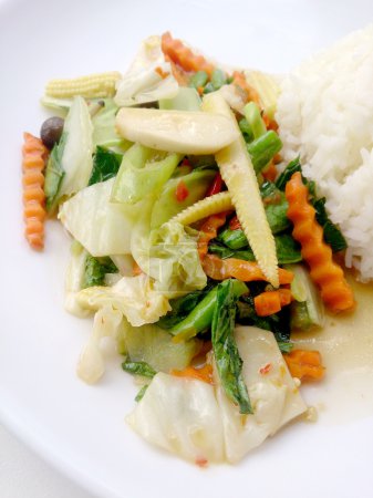 Photo for Vegetarian stir fry with thai jasmine rice on white dish, healthy food - Royalty Free Image