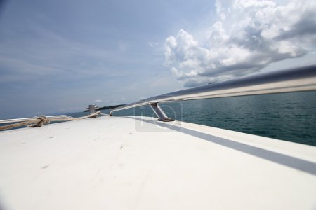 Photo for Sailing on boat concept with mountain and clouds. Day time shot - Royalty Free Image