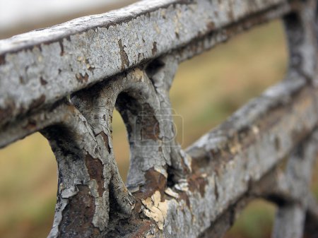 Old iron fence with peeling paint of bridge in Tver, Russia