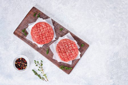 Photo for Raw minced beef patties for burgers. Raw meat for hamburgers. Beef cutlets. - Royalty Free Image