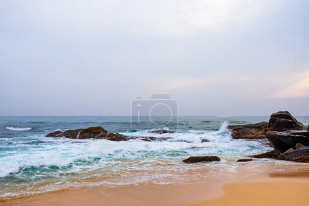 Landscape rocky tropical beach.