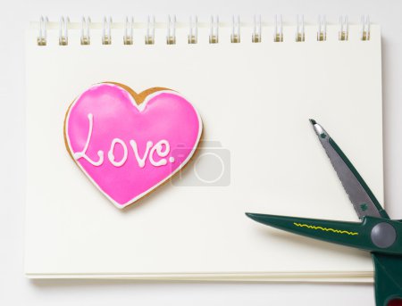 Photo for Cutting a Heart from the love diary. - Royalty Free Image